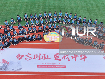 Prosecutors organize a ''9.18'' patriotic education activity on the campus of No. 1 Middle School in Lianyungang, China, on September 18, 20...