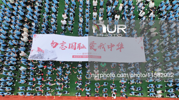 Prosecutors organize a ''9.18'' patriotic education activity on the campus of No. 1 Middle School in Lianyungang, China, on September 18, 20...