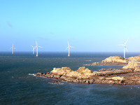 Wind turbines stand in the sea and rotate continuously at Pingtan Comprehensive Experimental Zone in Fujian, China, on September 17, 2024. (