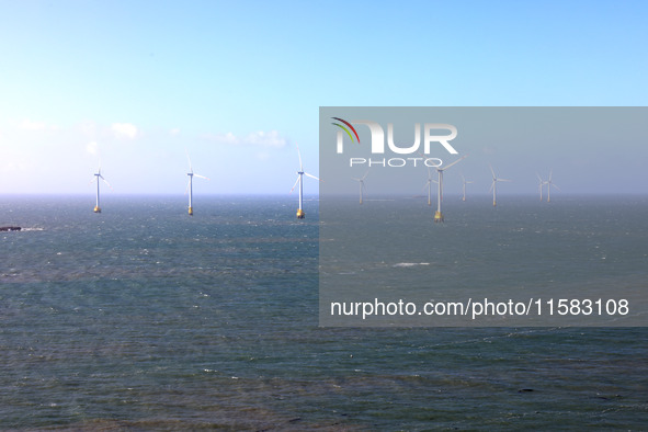 Wind turbines stand in the sea and rotate continuously at Pingtan Comprehensive Experimental Zone in Fujian, China, on September 17, 2024. 