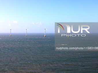 Wind turbines stand in the sea and rotate continuously at Pingtan Comprehensive Experimental Zone in Fujian, China, on September 17, 2024. (