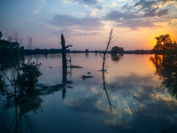 A sunset over an area covered with water after Nysa Klodzka river flooded town of Lewin Brzeski in southwestern Poland, on September 17th, 2...