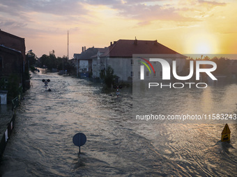 A sunset over an area covered with water after Nysa Klodzka river flooded town of Lewin Brzeski in southwestern Poland, on September 17th, 2...