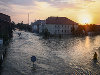 A sunset over an area covered with water after Nysa Klodzka river flooded town of Lewin Brzeski in southwestern Poland, on September 17th, 2...