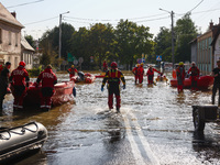 Residents are being evacuated by emergency workers after Nysa Klodzka river flooded town of Lewin Brzeski in southwestern Poland, on Septemb...