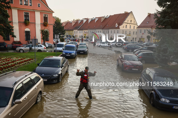 Residents are being evacuated by emergency workers after Nysa Klodzka river flooded town of Lewin Brzeski in southwestern Poland, on Septemb...