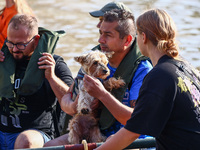 Residents are being evacuated by emergency workers after Nysa Klodzka river flooded town of Lewin Brzeski in southwestern Poland, on Septemb...