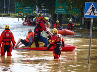 Residents are being evacuated by emergency workers after Nysa Klodzka river flooded town of Lewin Brzeski in southwestern Poland, on Septemb...