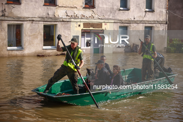 Residents are being evacuated by emergency workers after Nysa Klodzka river flooded town of Lewin Brzeski in southwestern Poland, on Septemb...