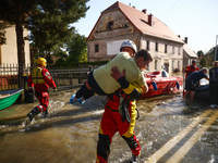 Residents are being evacuated by emergency workers after Nysa Klodzka river flooded town of Lewin Brzeski in southwestern Poland, on Septemb...