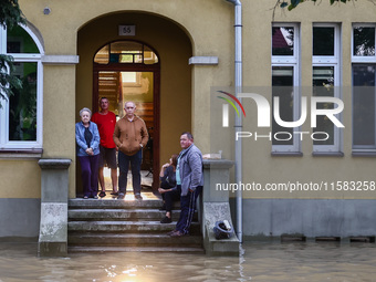 Residents are seen after Nysa Klodzka river flooded town of Lewin Brzeski in southwestern Poland, on September 17th, 2024. Storm Boris has c...