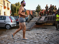 A resident is walking in the city after Nysa Klodzka river flooded town of Lewin Brzeski in southwestern Poland, on September 17th, 2024. St...