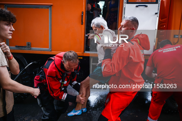 Residents are being evacuated by emergency workers after Nysa Klodzka river flooded town of Lewin Brzeski in southwestern Poland, on Septemb...