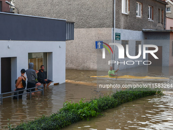 Residents are seen after Nysa Klodzka river flooded town of Lewin Brzeski in southwestern Poland, on September 17th, 2024. Storm Boris has c...