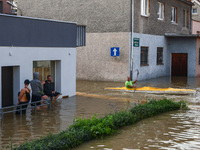 Residents are seen after Nysa Klodzka river flooded town of Lewin Brzeski in southwestern Poland, on September 17th, 2024. Storm Boris has c...