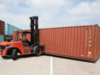 A worker drives a forklift truck to load and unload containers at Nanchang International Dry Port in Nanchang, China, on September 18, 2024....