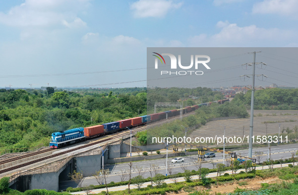 A special export container train loaded with auto parts leaves Nanchang International Dry Port in Nanchang, China, on September 18, 2024. 