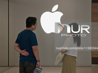 Customers are seen at an Apple Store near Nanjing Road Pedestrian Street in Shanghai, China, on September 18, 2024. (