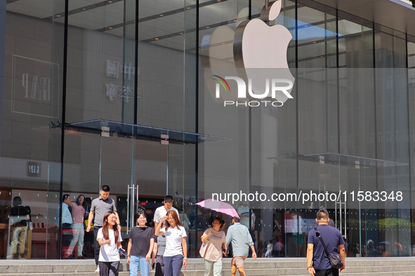 Customers are seen at an Apple Store near Nanjing Road Pedestrian Street in Shanghai, China, on September 18, 2024. 