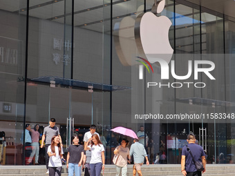 Customers are seen at an Apple Store near Nanjing Road Pedestrian Street in Shanghai, China, on September 18, 2024. (