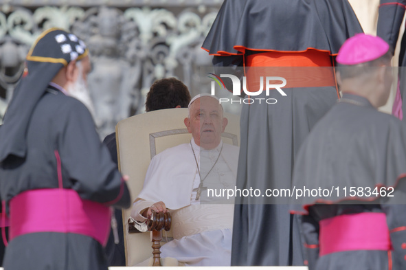 Pope Francis greets bishops and cardinals at the end of his Wednesday general audience in Saint Peter's Square 