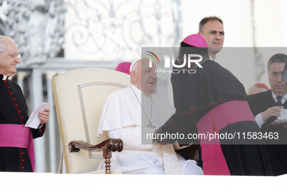 Pope Francis greets bishops and cardinals at the end of his Wednesday general audience in Saint Peter's Square 