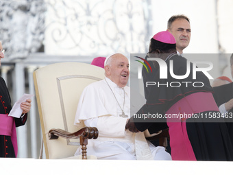 Pope Francis greets bishops and cardinals at the end of his Wednesday general audience in Saint Peter's Square (