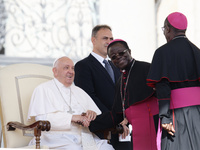 Pope Francis greets bishops and cardinals at the end of his Wednesday general audience in Saint Peter's Square (