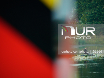 A fisherman is seen on the Polish side of the Oder river in this photo taken in Frankfurt (Oder) on 17 September, 2024. After warnings of in...