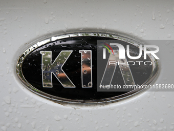 The Kia logo in the rain appears on the street in Krakow, Poland, on August 21, 2024. (