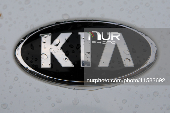 The Kia logo in the rain appears on the street in Krakow, Poland, on August 21, 2024. 