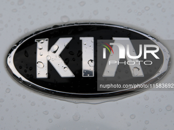 The Kia logo in the rain appears on the street in Krakow, Poland, on August 21, 2024. (