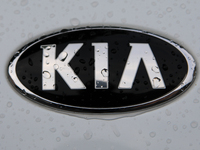 The Kia logo in the rain appears on the street in Krakow, Poland, on August 21, 2024. (