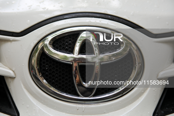 The Toyota logo in the rain is seen on the street in Krakow, Poland, on August 21, 2024. 