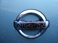 The Nissan logo in the rain is seen on the street in Krakow, Poland, on August 21, 2024. (