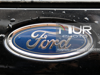 The Ford logo in the rain appears on the street in Krakow, Poland, on August 21, 2024. (