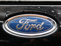 The Ford logo in the rain appears on the street in Krakow, Poland, on August 21, 2024. (