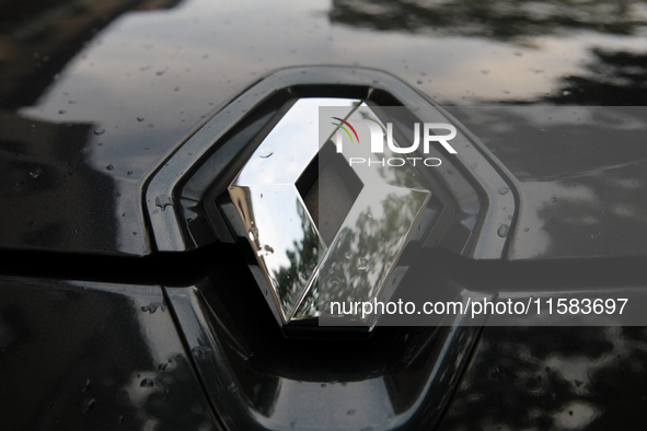 The Renault logo in the rain is seen on the street in Krakow, Poland, on August 21, 2024. 