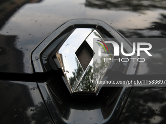 The Renault logo in the rain is seen on the street in Krakow, Poland, on August 21, 2024. (