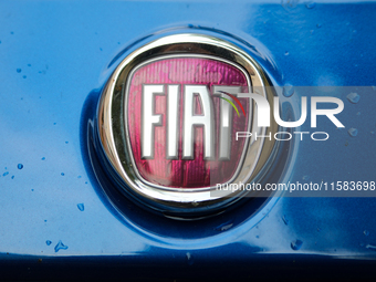 A Fiat logo in the rain is seen on the street in Krakow, Poland, on August 21, 2024. (