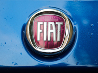 A Fiat logo in the rain is seen on the street in Krakow, Poland, on August 21, 2024. (