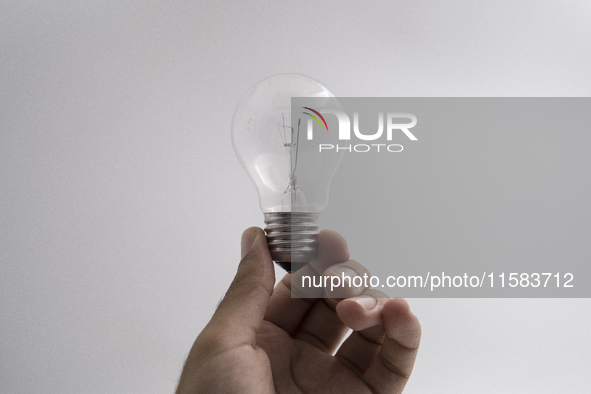 A hand holds a lamp in Chania, Crete Island, Greece, on September 18, 2024. 