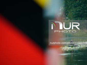 A fisherman is seen on the Polish side of the Oder river in this photo taken in Frankfurt (Oder) on 17 September, 2024. After warnings of in...