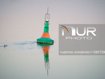 A buoy is seen floating in the Oder river in Frankfurt (Oder) on 17 September, 2024. After warnings of increasing water levels on several ri...