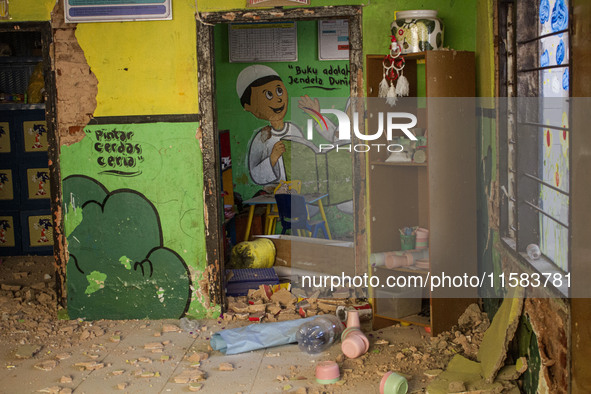 The wall of a kindergarten school collapses after a magnitude 5.0 earthquake strikes in West Java, Indonesia, on September 18, 2024. At leas...