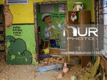 The wall of a kindergarten school collapses after a magnitude 5.0 earthquake strikes in West Java, Indonesia, on September 18, 2024. At leas...