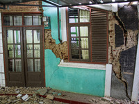 The ruins of a house collapse after a 5.0 magnitude earthquake strikes in Kertasari, West Java, on September 18, 2024. At least 700 houses a...