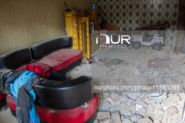 The ruins of a house collapse after a 5.0 magnitude earthquake strikes in Kertasari, West Java, on September 18, 2024. At least 700 houses a...