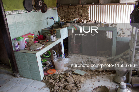 The ruins of a house collapse after a 5.0 magnitude earthquake strikes in Kertasari, West Java, on September 18, 2024. At least 700 houses a...