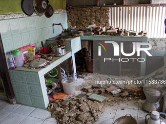 The ruins of a house collapse after a 5.0 magnitude earthquake strikes in Kertasari, West Java, on September 18, 2024. At least 700 houses a...